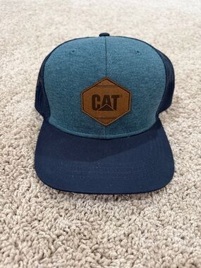 Blue and Navy Trucker Cap with Leather CAT Patch